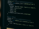 Computer screen with code for integrating betting signals into Discord and Slack via webhooks,